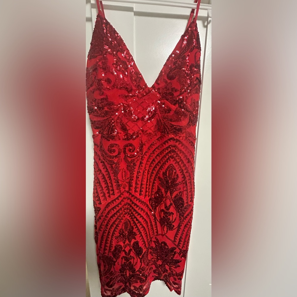 Leyva’s 8869 Elegant Red Sequin Mini Dress